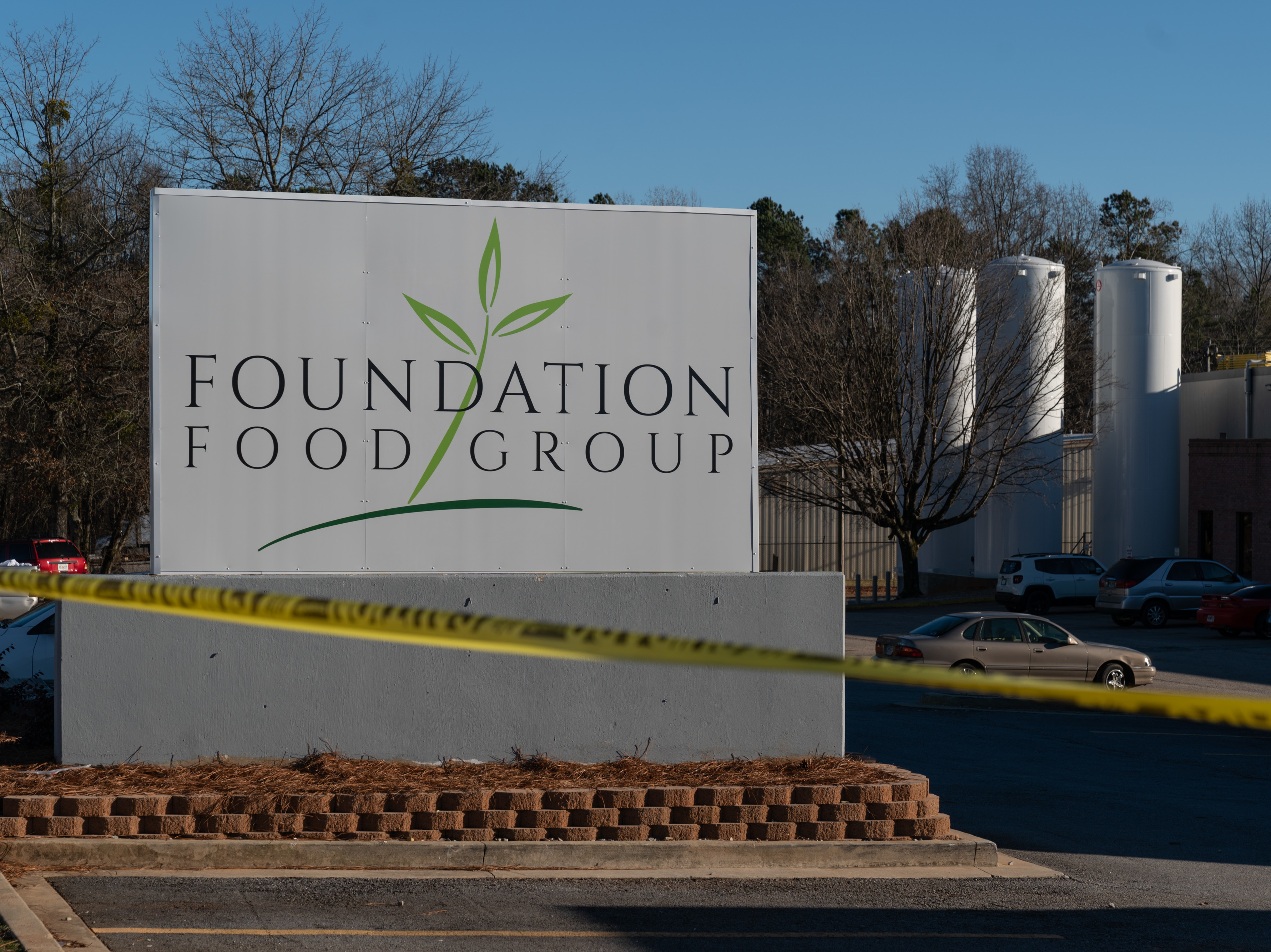 caption: Tanks of liquid nitrogen are seen at the Foundation Food Group poultry processing plant in Gainesville, Ga. Six workers died after a freezer malfunctioned in January 2021.