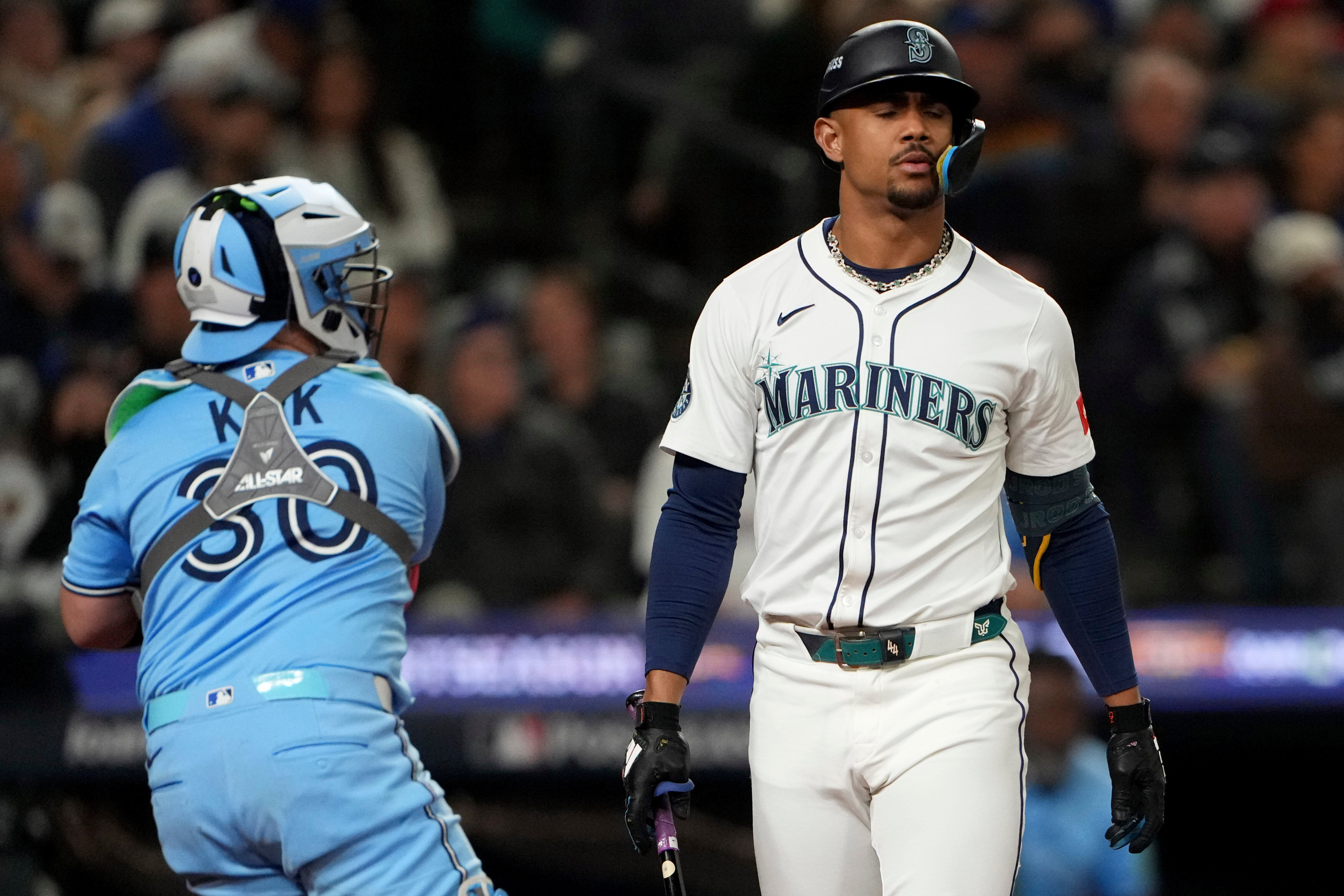 caption: Seattle Mariners' Julio Rodríguez reacts after striking out during the eighth inning in Game 4 of baseball's American League Championship Series against the Toronto Blue Jays, Thursday, Oct. 16, 2025, in Seattle. 