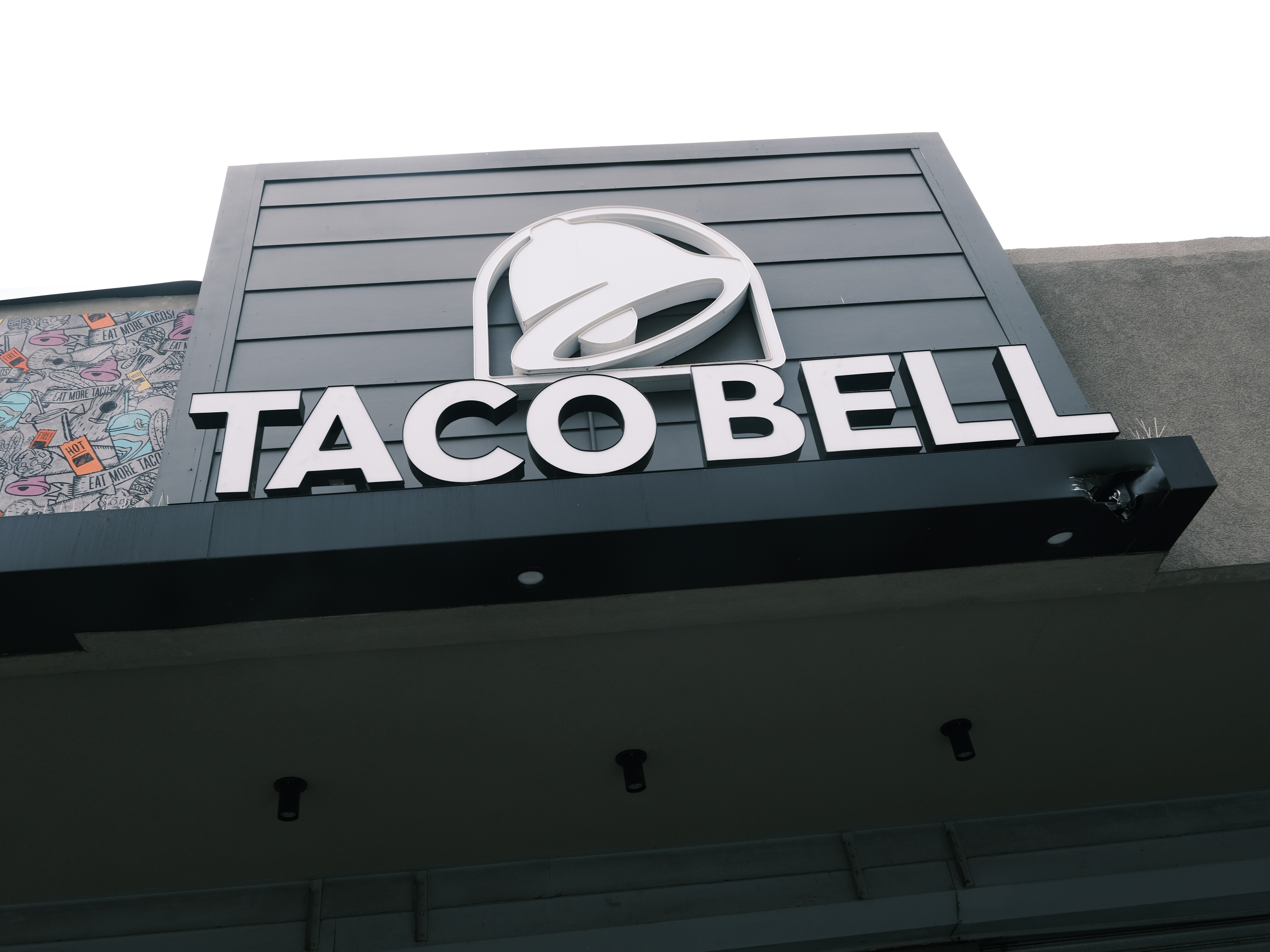 A Taco Bell restaurant stands along a Queens street on July 21, 2021 in New York City.