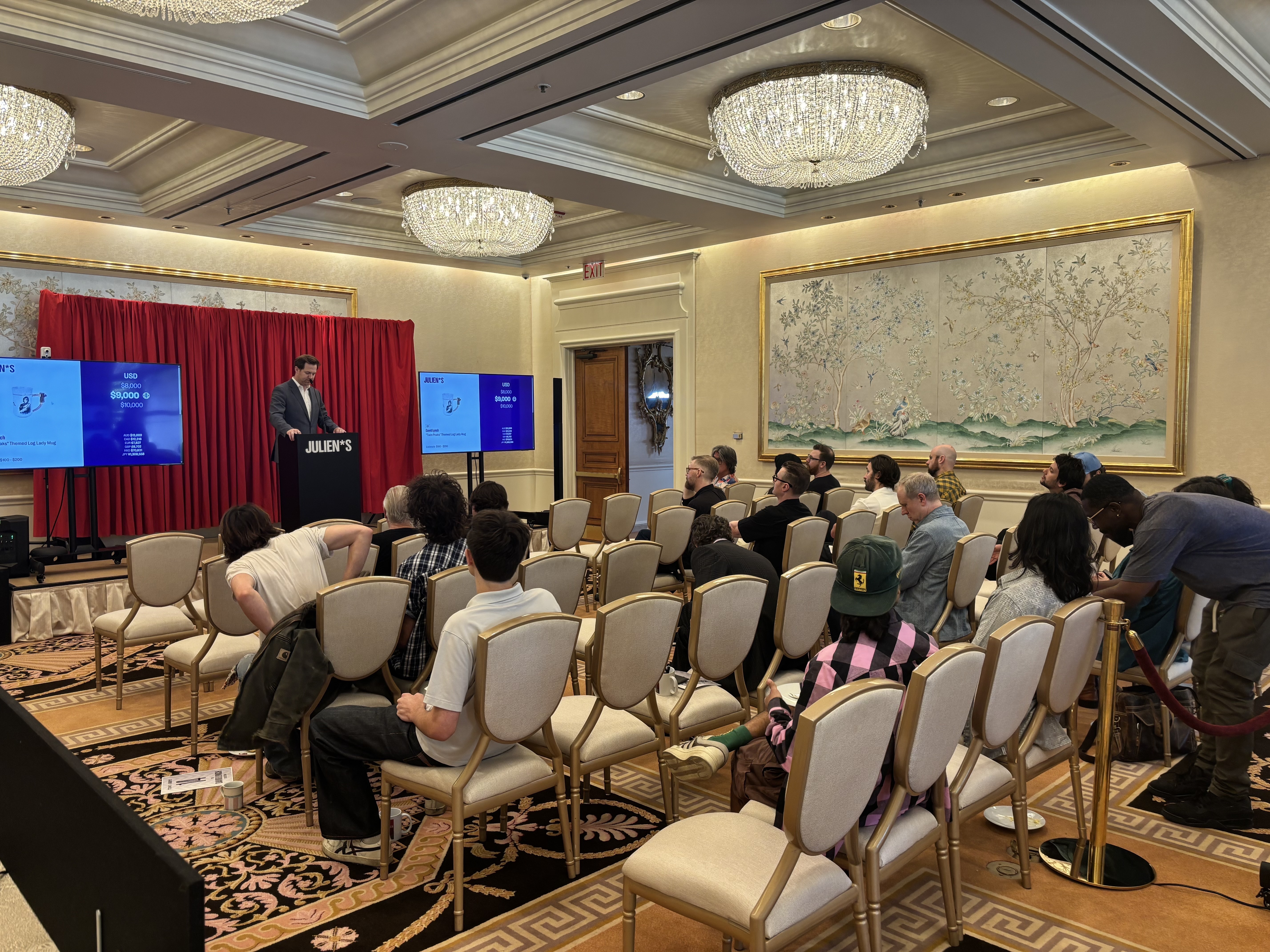 caption: At The Peninsula Beverly Hills hotel in Los Angeles, Julien's auction house sold a collection of 450 items belonging to the late writer-director David Lynch, where on-site bidders were abuzz with Lynch's coffee and carpentry paraphernalia.