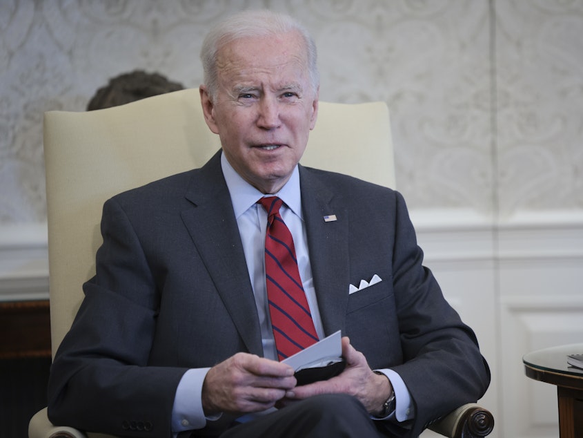 caption: President Biden speaks at a meeting in the Oval Office on Tuesday. He announced the relaunch of the "Cancer Moonshot" project the following day.