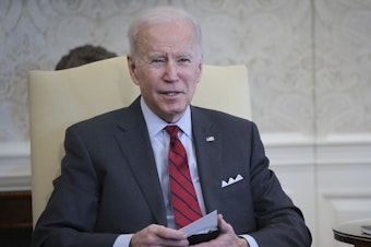 caption: President Biden speaks at a meeting in the Oval Office on Tuesday. He announced the relaunch of the "Cancer Moonshot" project the following day.