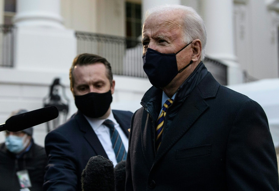 caption: President Biden speaks to the press before departing the White House for Milwaukee, Wis. on Feb. 16.