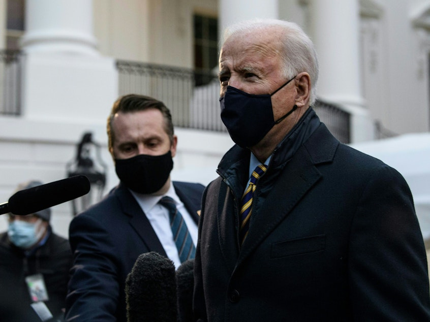 caption: President Biden speaks to the press before departing the White House for Milwaukee, Wis. on Feb. 16.