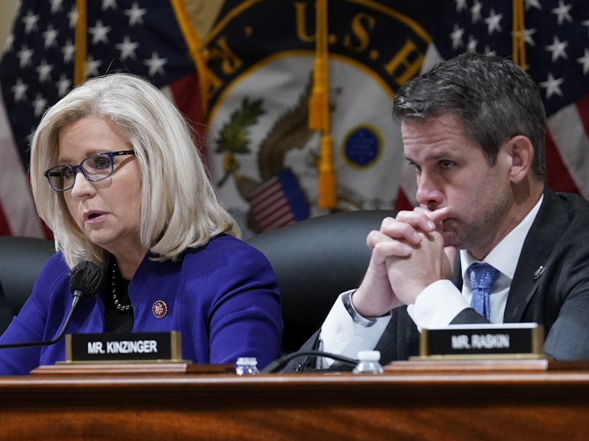 caption: Rep. Liz Cheney, R-Wyo., and Rep. Adam Kinzinger, R-Ill., listen as the House select committee tasked with investigating the Jan. 6 attack on the U.S. Capitol meets on Oct. 19, 2021.