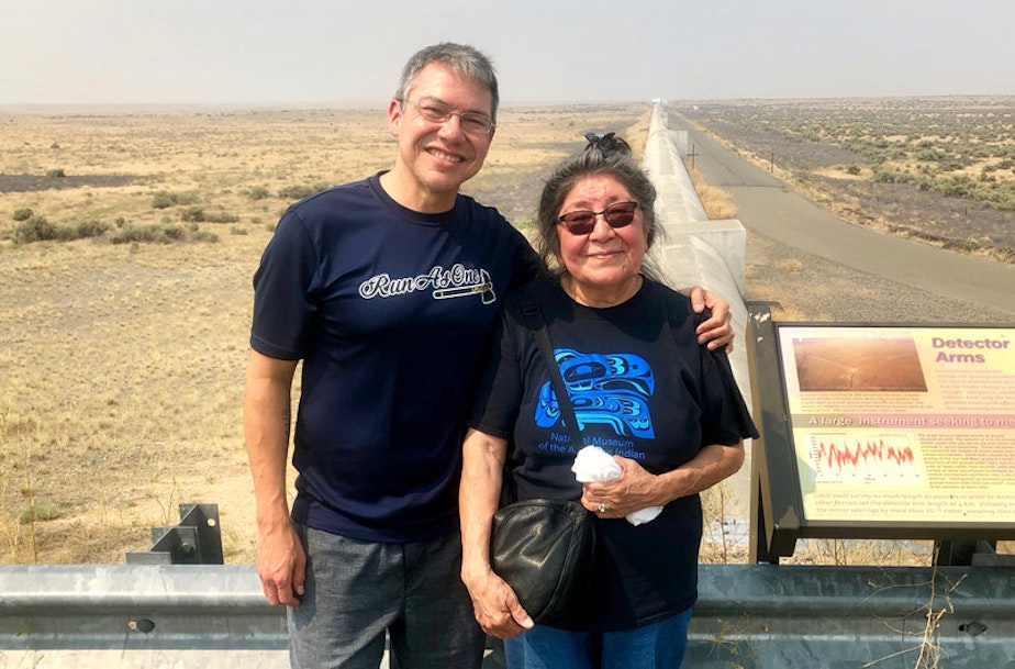 caption: Physicist Corey Gray and his mother, Sharon Yellowfly, are pictured at one of the two massive detectors that make up the Laser Interferometer Gravitational-Wave Observatory. One facility, where Gray works, is in Hanford, Wash., and the other is in Louisiana.Courtesy of Russell Barber