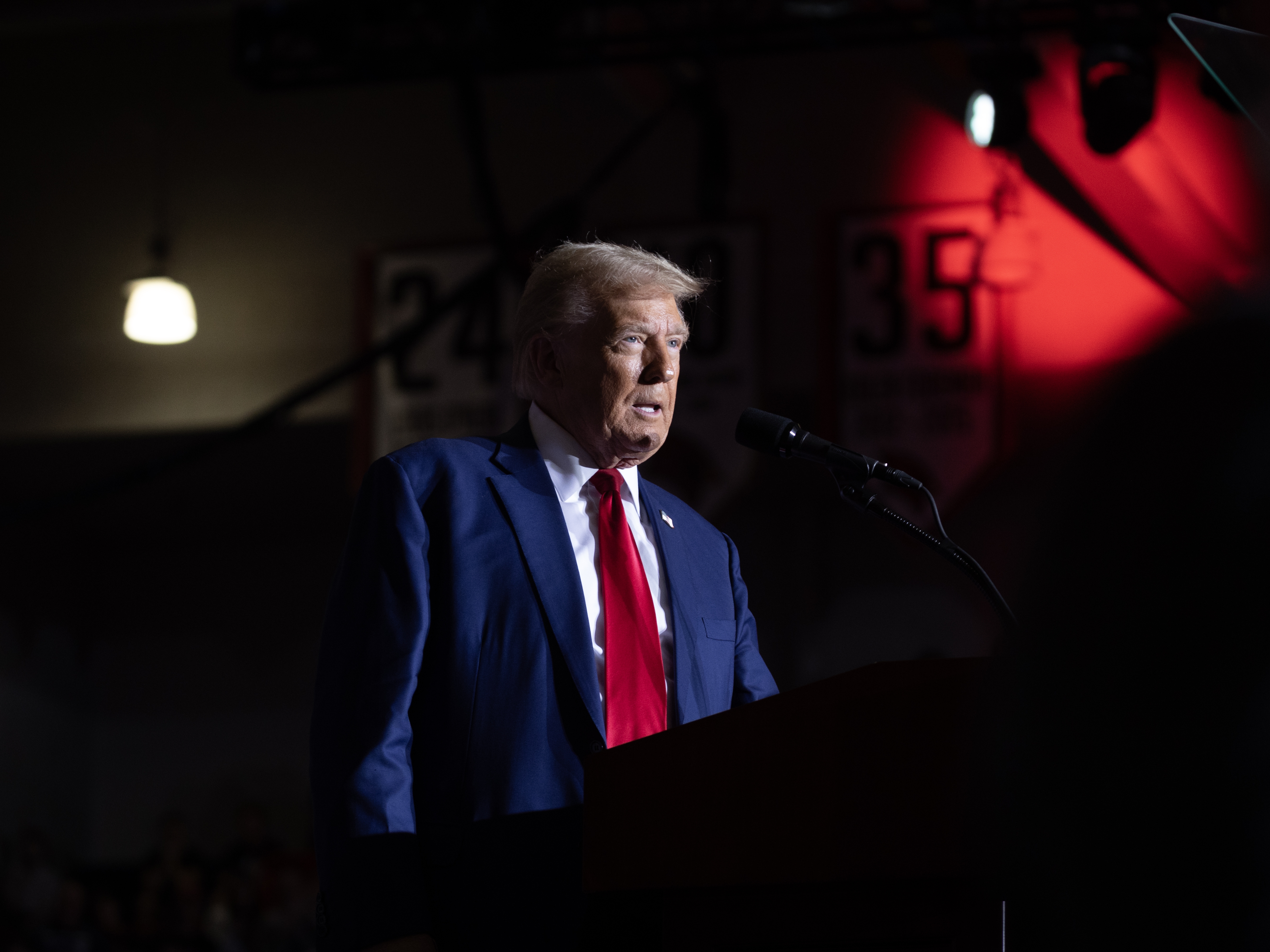 caption: Former President Donald Trump speaks to supporters during a campaign event at Saginaw Valley State University on Oct. 3 in Saginaw, Mich.