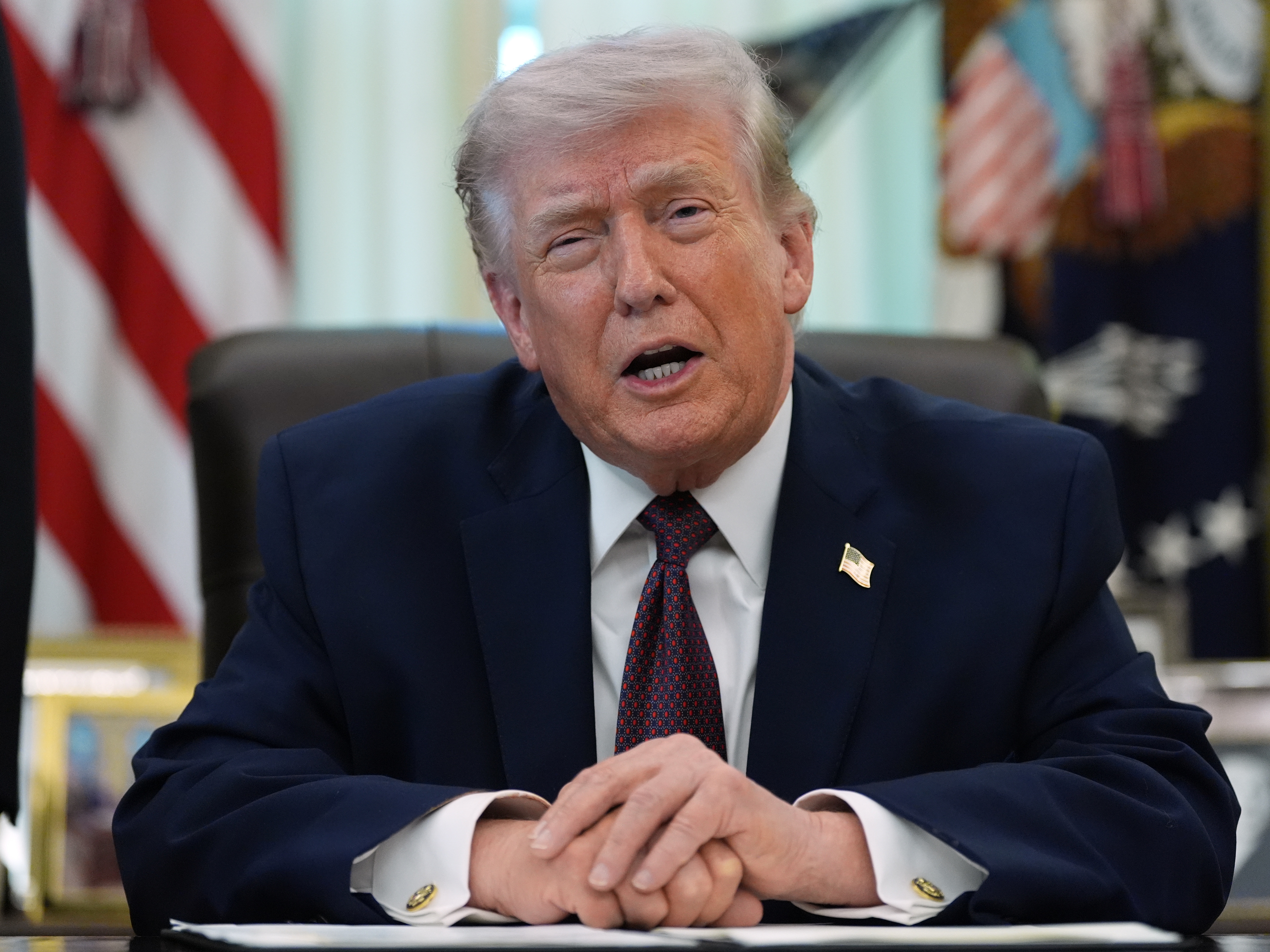 caption: President Donald Trump speaks in the Oval Office of the White House before signing an executive order Tuesday, March 31, 2026, in Washington.