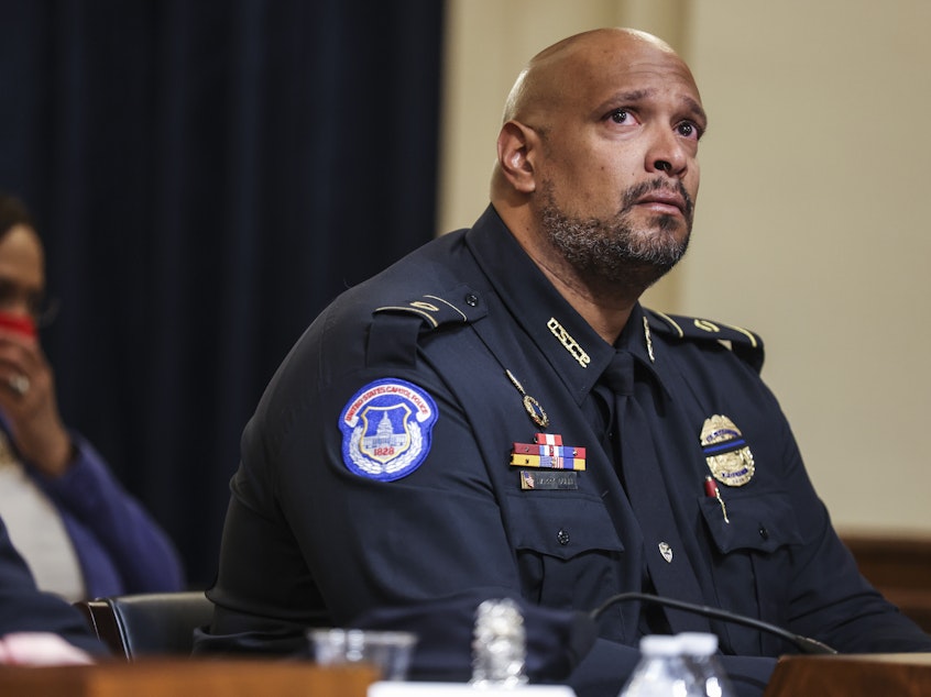 caption: U.S. Capitol Police Sgt. Harry Dunn testifies during the House select committee hearing on the Jan. 6 attack on Capitol Hill in Washington Tuesday.