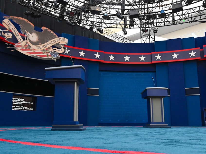 caption: The stage of the first presidential debate, in Cleveland. Tuesday's debate between President Trump and Democratic nominee Joe Biden will be the first of three 90-minute debates between the two.