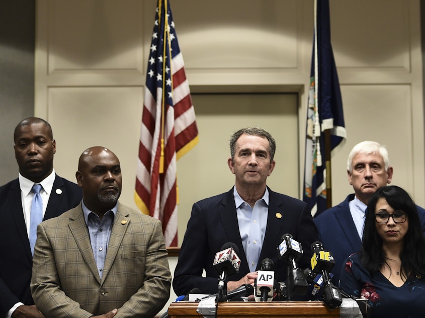 caption: Virginia Gov. Ralph Northam speaks at a news conference Saturday about the mass shooting in Virginia Beach the day before.