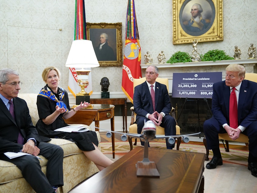 caption: Dr. Deborah Birx, head of the White House coronavirus task force, speaks during an Oval Office meeting with Dr. Anthony Fauci (left), director of the National Institute of Allergy and Infectious Diseases; Louisiana Gov. John Bel Edwards; and President Trump on Wednesday.