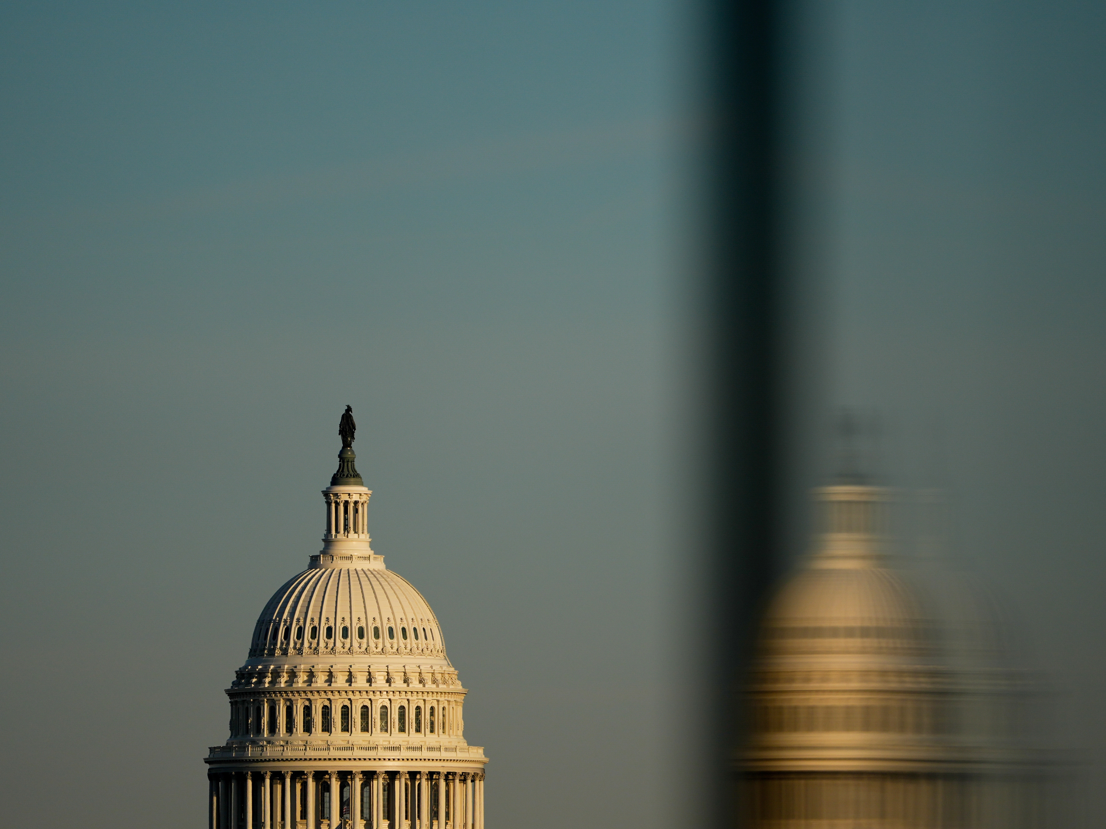 caption: The Capitol is seen from the base of the Washington Monument  on Tuesday, Dec. 16, 2025, in Washington.