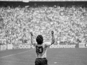 caption: Diego Maradona celebrating Argentina victory of World Cup at Azteca stadium, Mexico City, World Cup 1986.