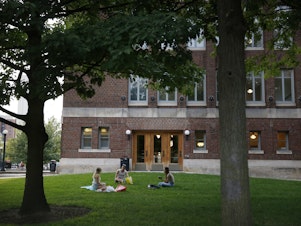 caption: Students on campus at the University of Michigan.