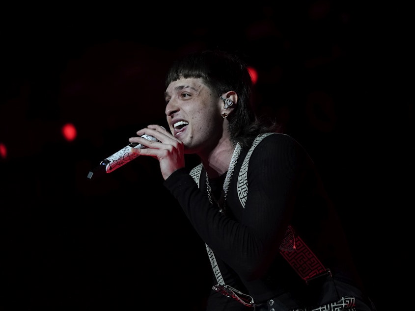 caption: Mexican singer Peso Pluma performs in concert at the Foro Sol in Mexico City, Saturday, Nov. 11, 2023.
