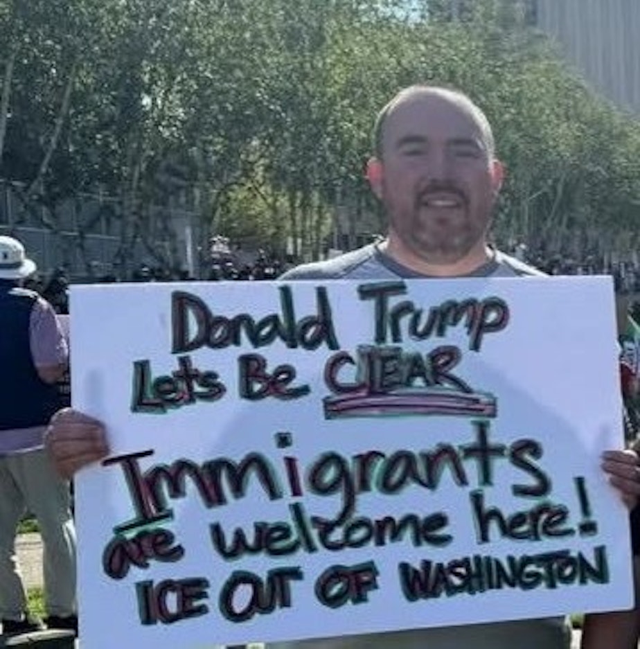 caption: Tom Clarke at a protest in Everett, WA, on June 14th, 2025.