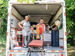 caption: Tasharn Richardson's 11-year-old son, Lionel, helps unload the moving truck at their new home in Washington, D.C. To Tasharn, having a house to call her own always seemed like someone else's dream.