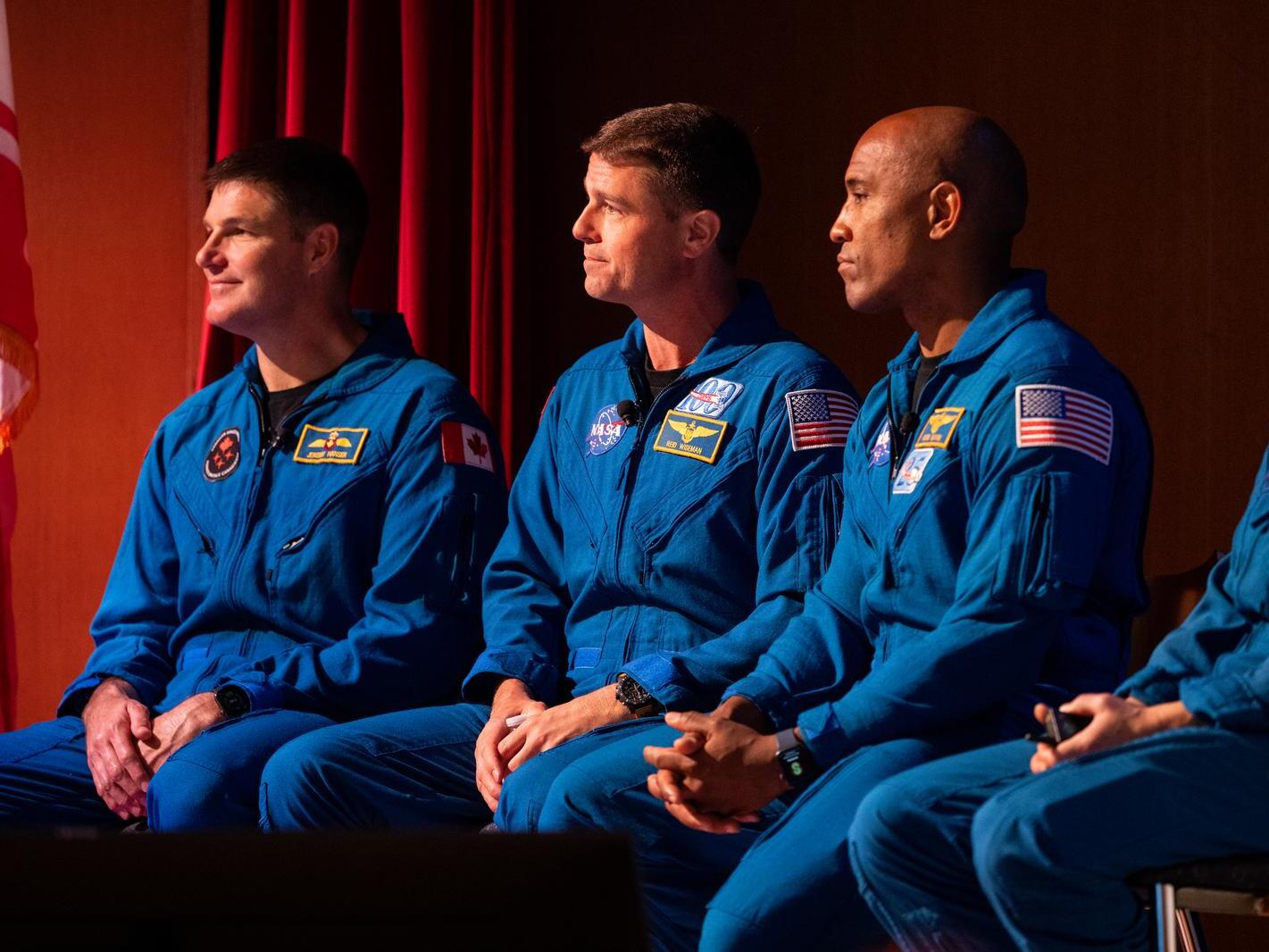 caption: CSA (Canadian Space Agency) astronaut Jeremy Hansen, left, and NASA astronauts Reid Wiseman, Victor Glover, and Christina Hammock Koch, in 2023 at NASA's Goddard Space Flight Center. Their mission to go around the moon has been delayed until at least April, 2026.