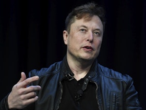 caption: Tesla and SpaceX CEO Elon Musk speaks at the SATELLITE Conference and Exhibition on March 9, 2020, in Washington.