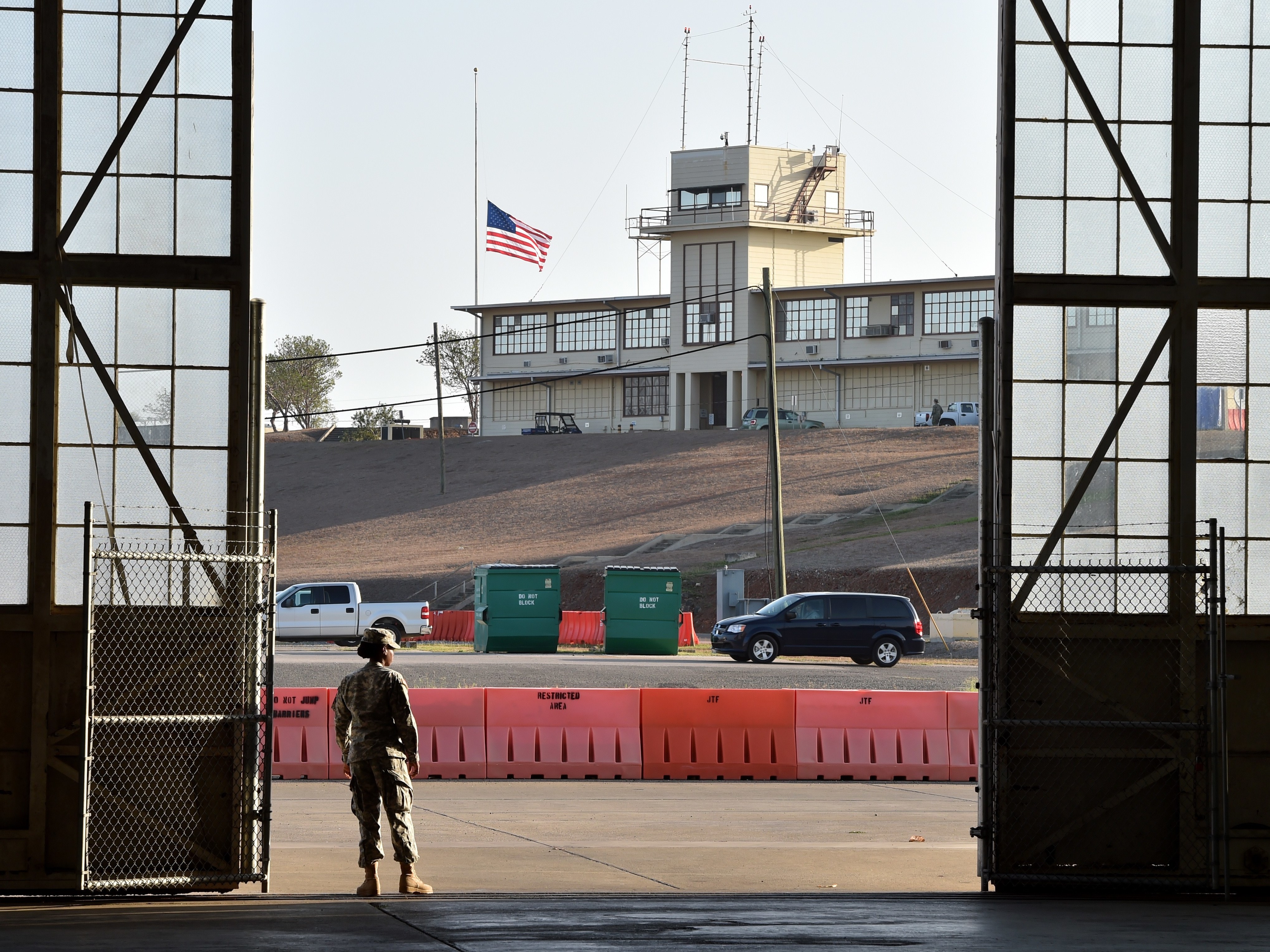 caption: This photo, reviewed by the U.S. military and made during an escorted visit, shows the original military courtroom at the U.S. Navy base at Guantánamo Bay, Cuba, on April 9, 2014.