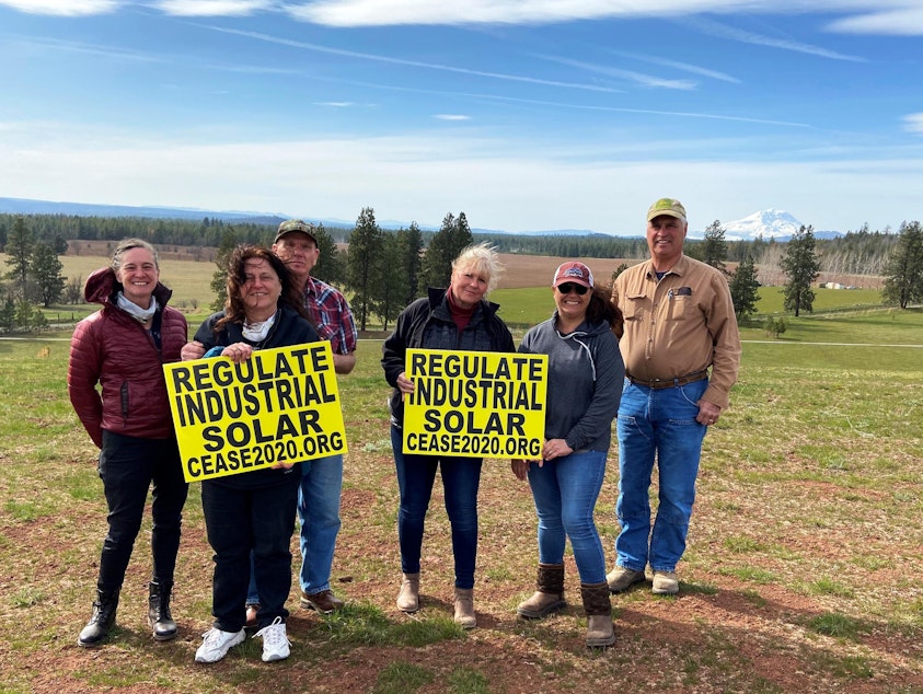 caption: Members of C.E.A.S.E - Citizens Educated About Solar Energy - gather on Amy Hanson's land (center right). Hanson and her husband, Russ, hoped to build their retirement home here, but stopped their plans once they learned their property could be hemmed in.