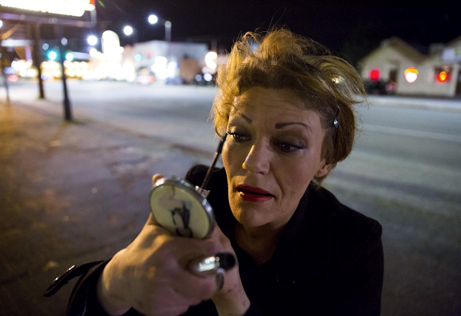 caption: Ericka is one of 50 to 60 prostitutes who work on Aurora Avenue North, known as a track. This is one of two tracks where prostitutes work in the Seattle area. Photographer Mike Kane followed her one evening, separately from the story below.