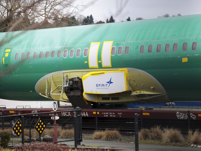 caption: Joshua Dean, who died on Tuesday, had gone public with his concerns about defects and quality-control problems at Spirit AeroSystems, a major supplier of parts for Boeing. Here, a Spirit AeroSystems logo is seen on a 737 fuselage sent to Boeing's factory in Renton, Wash., in January.