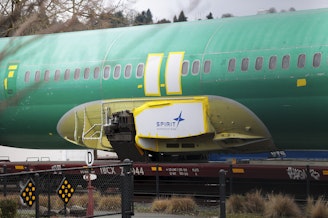 caption: Joshua Dean, who died on Tuesday, had gone public with his concerns about defects and quality-control problems at Spirit AeroSystems, a major supplier of parts for Boeing. Here, a Spirit AeroSystems logo is seen on a 737 fuselage sent to Boeing's factory in Renton, Wash., in January.