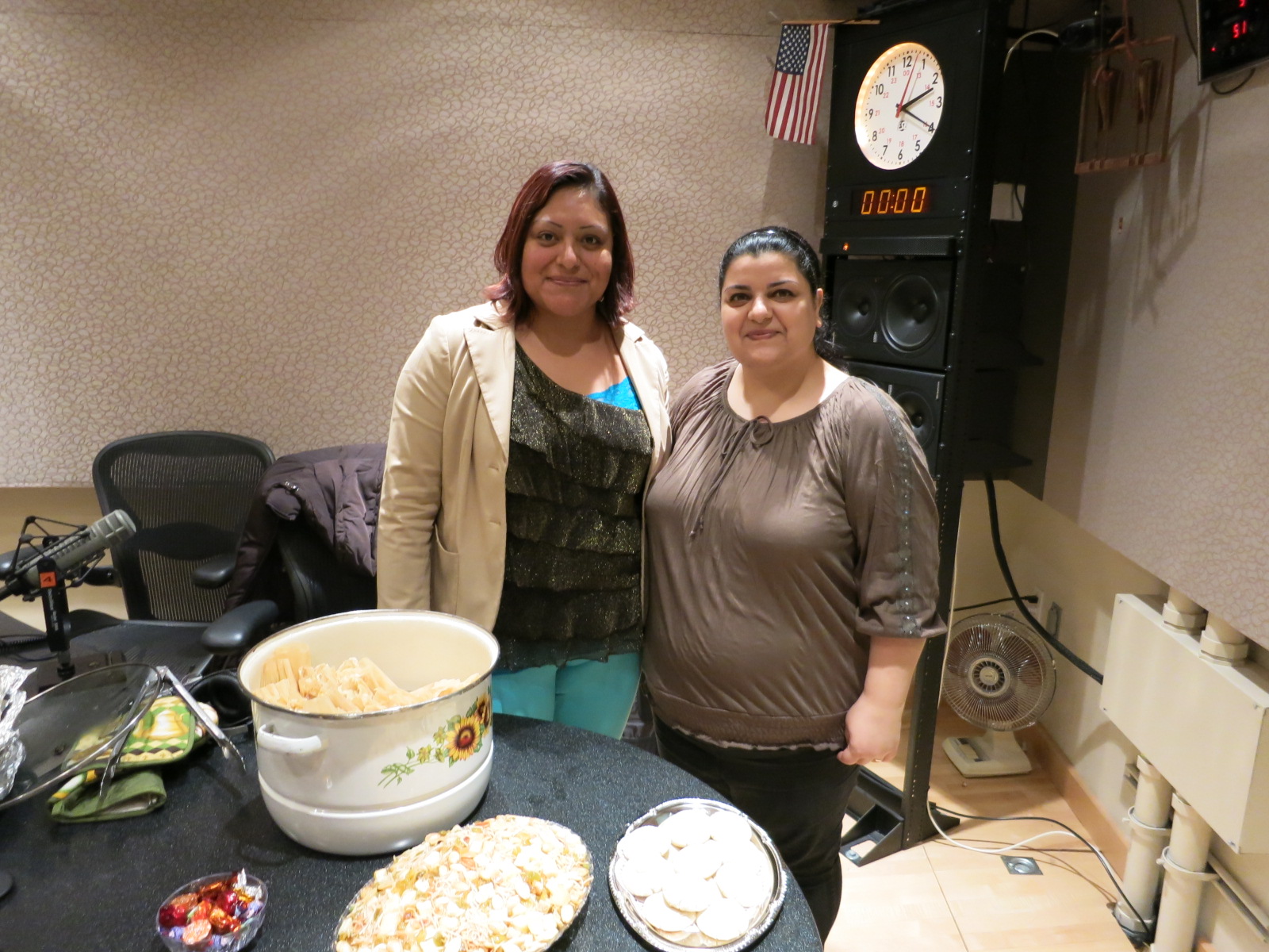 caption: Angelica Hernandez (left), who immigrated from Mexico two decades ago, stands with Taghreed Ibrahim (right) who came from Iraq just in time for Thanksgiving last year. Both are recent graduates of Project Feast's Commercial Kitchen Basics program.
