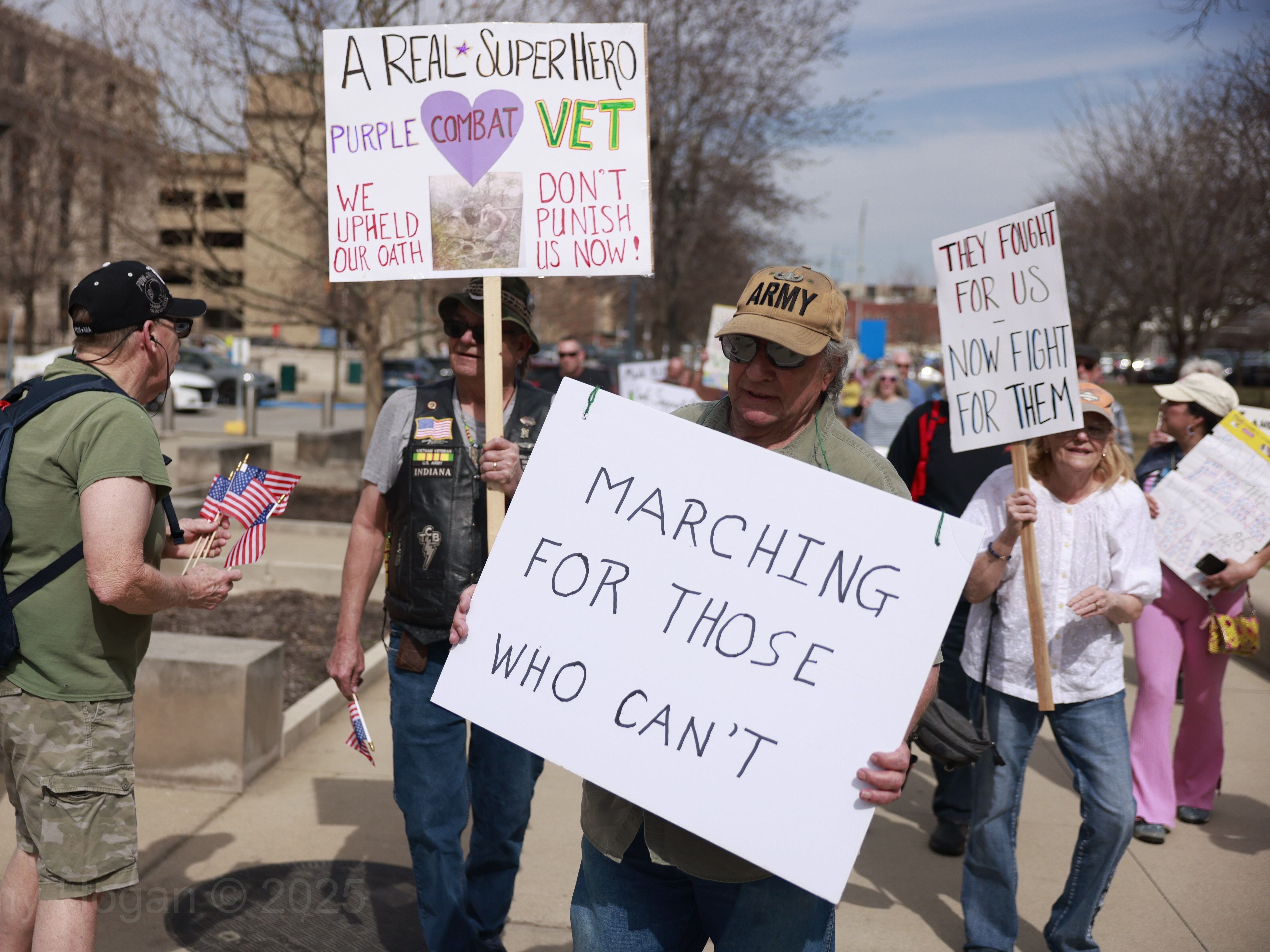 caption: Veterans gathered in Indianapolis and in places across the country on March 14 to protest the Trump administration's staff and budget cuts to the Department of Veterans Affairs.