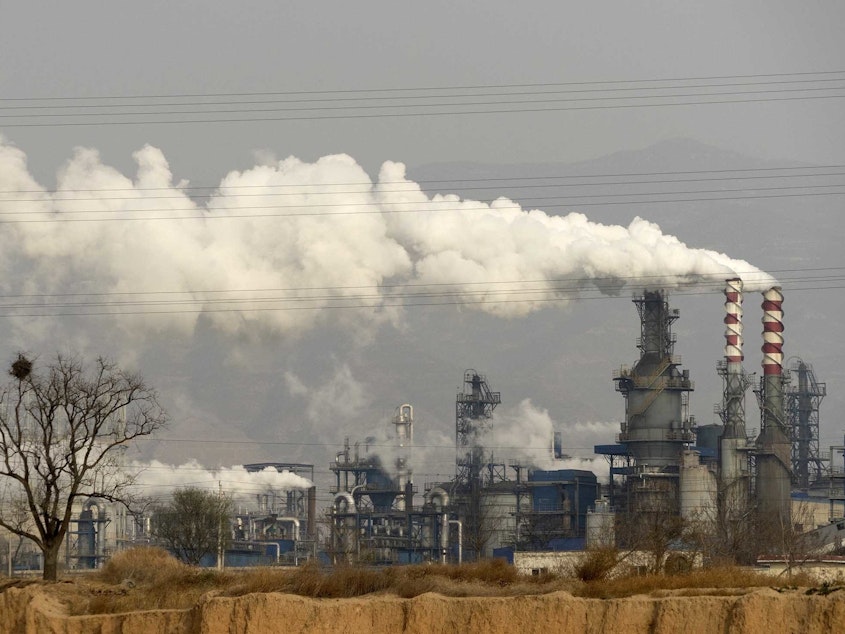 caption: Coal power has resurged since the pandemic, like at this coal processing plant in China's Shanxi Province, but research shows it should be phased out by 2030 to avoid extreme climate change.