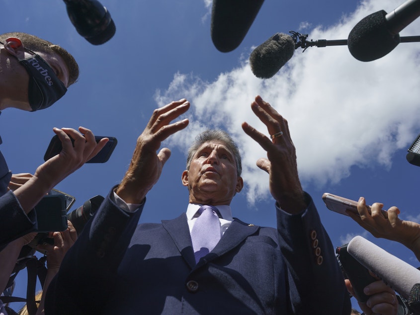 caption: Sen. Joe Manchin, D-W.Va., speaks with reporters on Capitol Hill on Sept. 30, 2021.