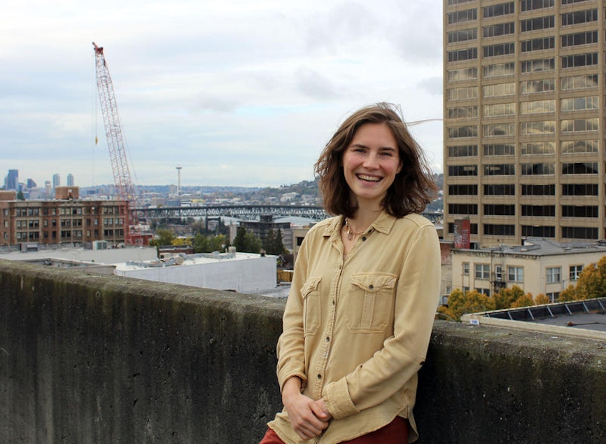 caption: Seattle resident Amanda Knox on the roof of the KUOW parking garage in Seattle's University District.
