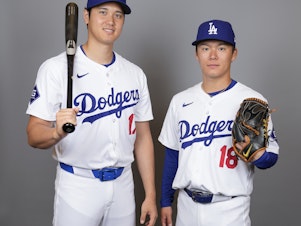 caption: Some critics of the new MLB uniform have pointed to this photo of Los Angeles Dodgers hitter Shohei Ohtani, (left), and starting pitcher Yoshinobu Yamamoto, taken on Wednesday, as an example of how see-through the new pants are.