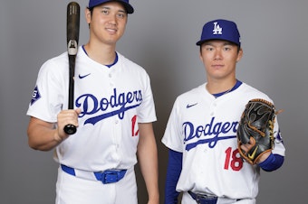 caption: Some critics of the new MLB uniform have pointed to this photo of Los Angeles Dodgers hitter Shohei Ohtani, (left), and starting pitcher Yoshinobu Yamamoto, taken on Wednesday, as an example of how see-through the new pants are.