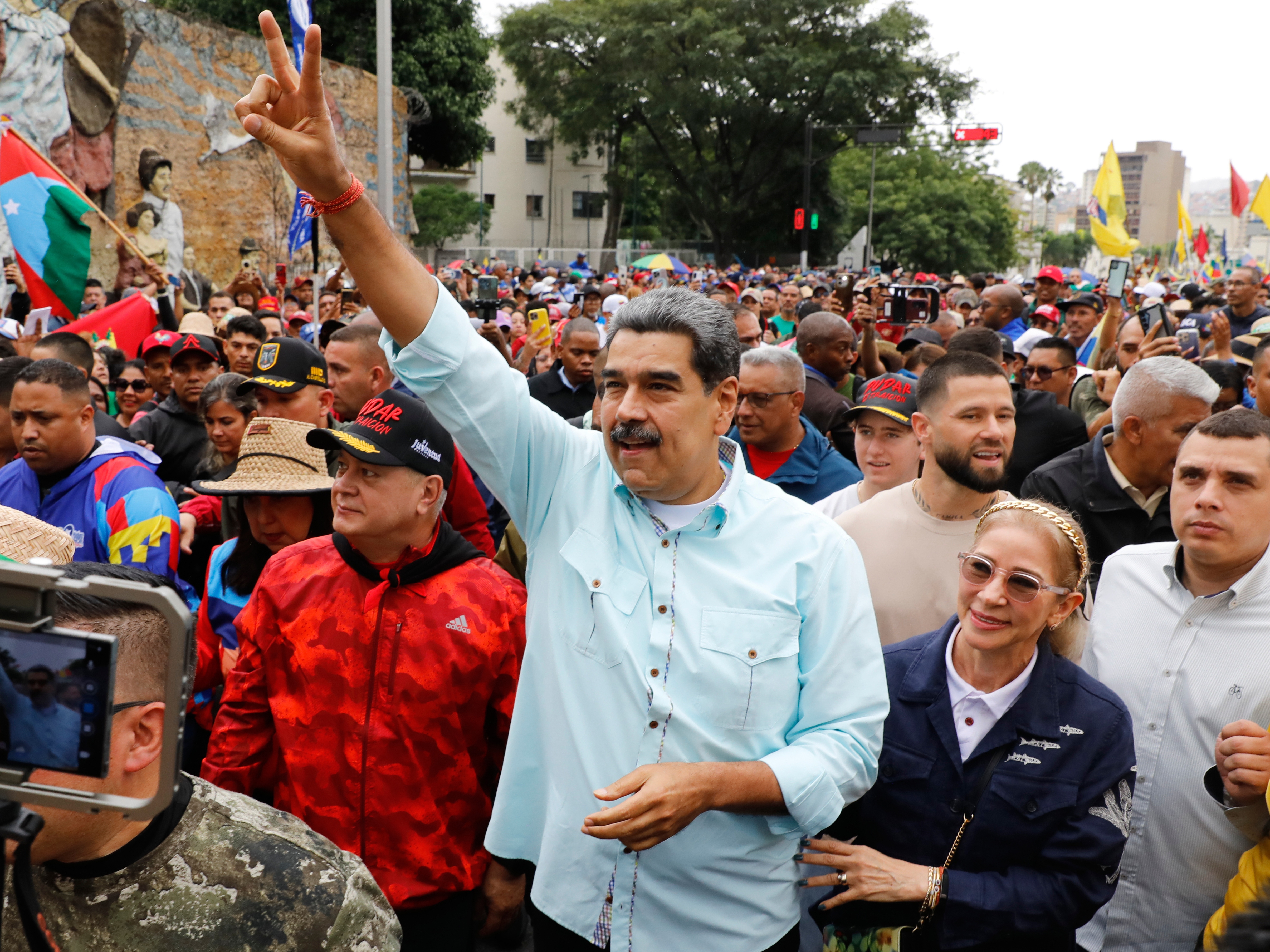 caption: President Nicolas Maduro joins a rally marking the anniversary of the Battle of Santa Ines, which took place during Venezuela's 19th-century Federal War, in Caracas, Venezuela, Wednesday, Dec. 10, 2025.