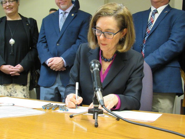 caption: <p>Oregon Governor Kate Brown signs a drought emergency declaration in Klamath Falls on Tuesday, March 13, 2018.</p>