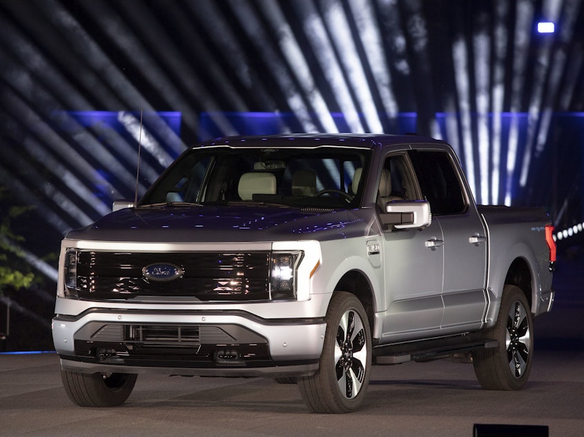 caption: Ford unveiled its new all-electric Ford F-150 Lightning pickup truck at Ford World Headquarters in Dearborn, Mich., on Wednesday. The truck will come with a price tag that starts at just under $40,000.