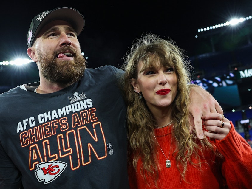 caption: Travis Kelce and Taylor Swift celebrate after the Kansas City Chiefs defeated the Baltimore Ravens in the AFC Championship Game at M&T Bank Stadium in Maryland on Sunday.