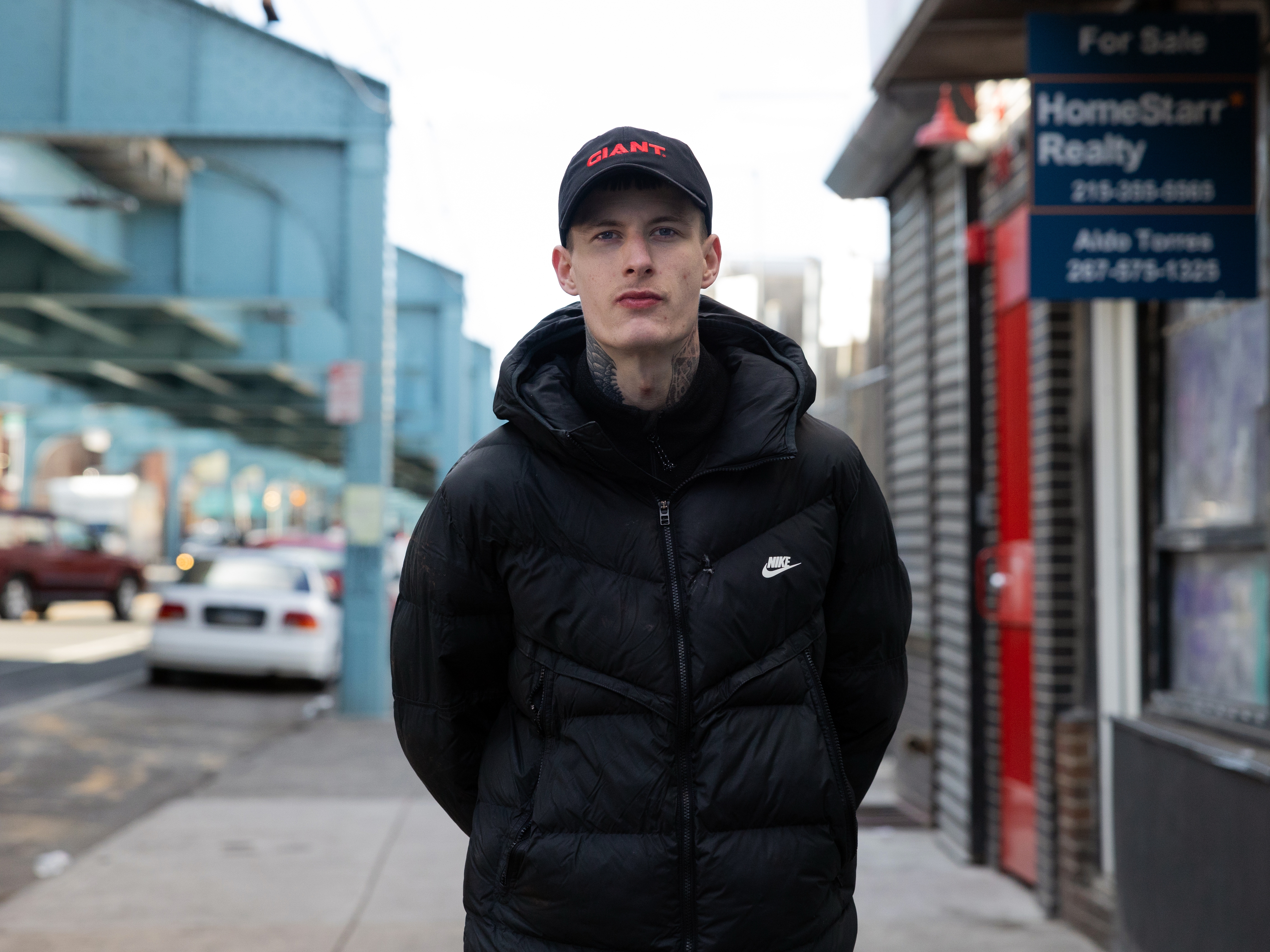 caption: Justin Carlyle, age 23, photographed on the street in Kensington, a neighborhood of Philadelphia, has lived with addiction to fentanyl and other drugs for a decade. After a decade when overdoses devastated young Americans, drug deaths among people in the U.S. under age 35 are plummeting. The shift is saving thousands of young lives every year.