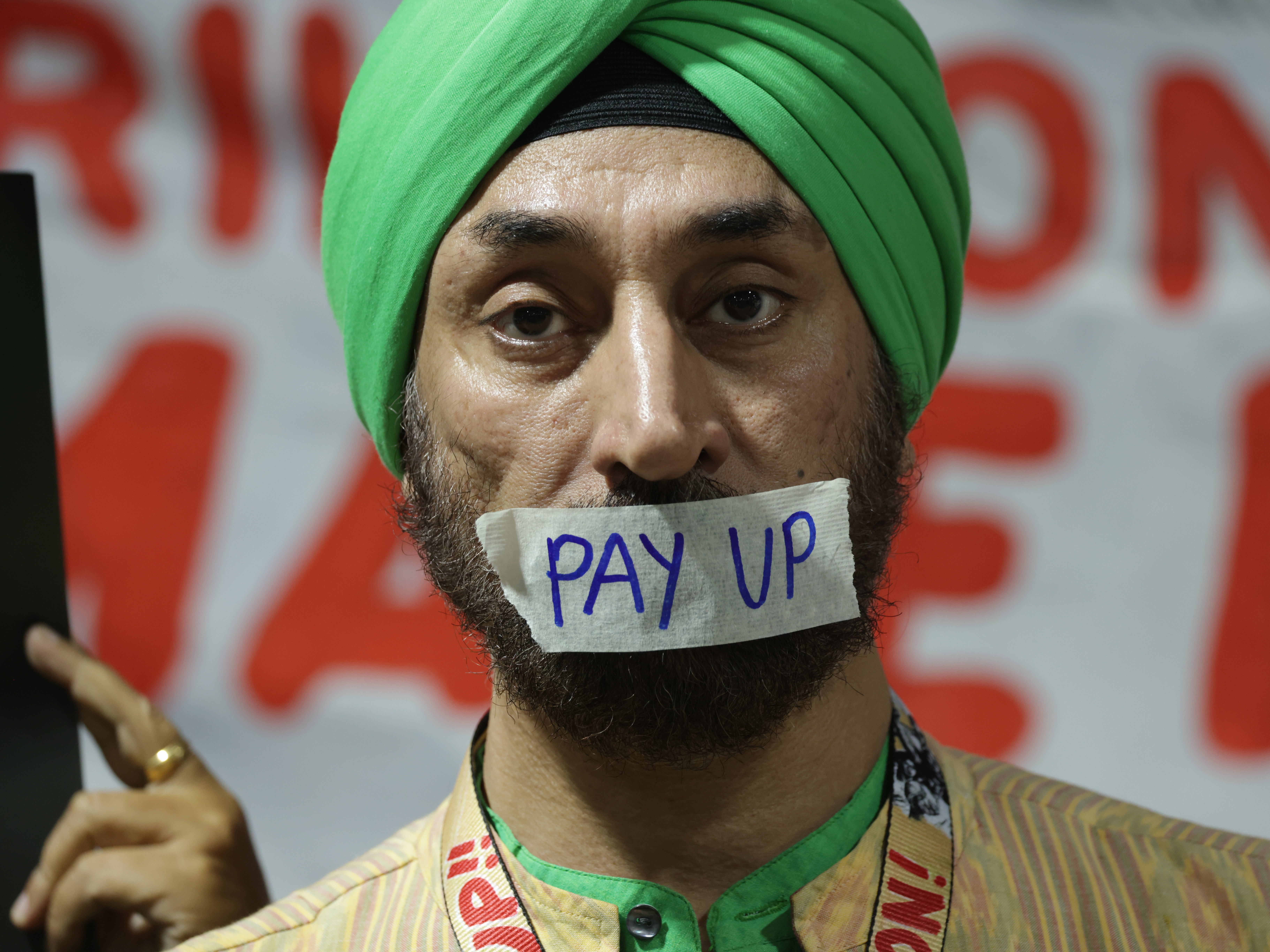 caption: Activists demanding that rich countries pay up for climate finance for developing countries at the COP29 climate conference in Baku, Azerbaijan.