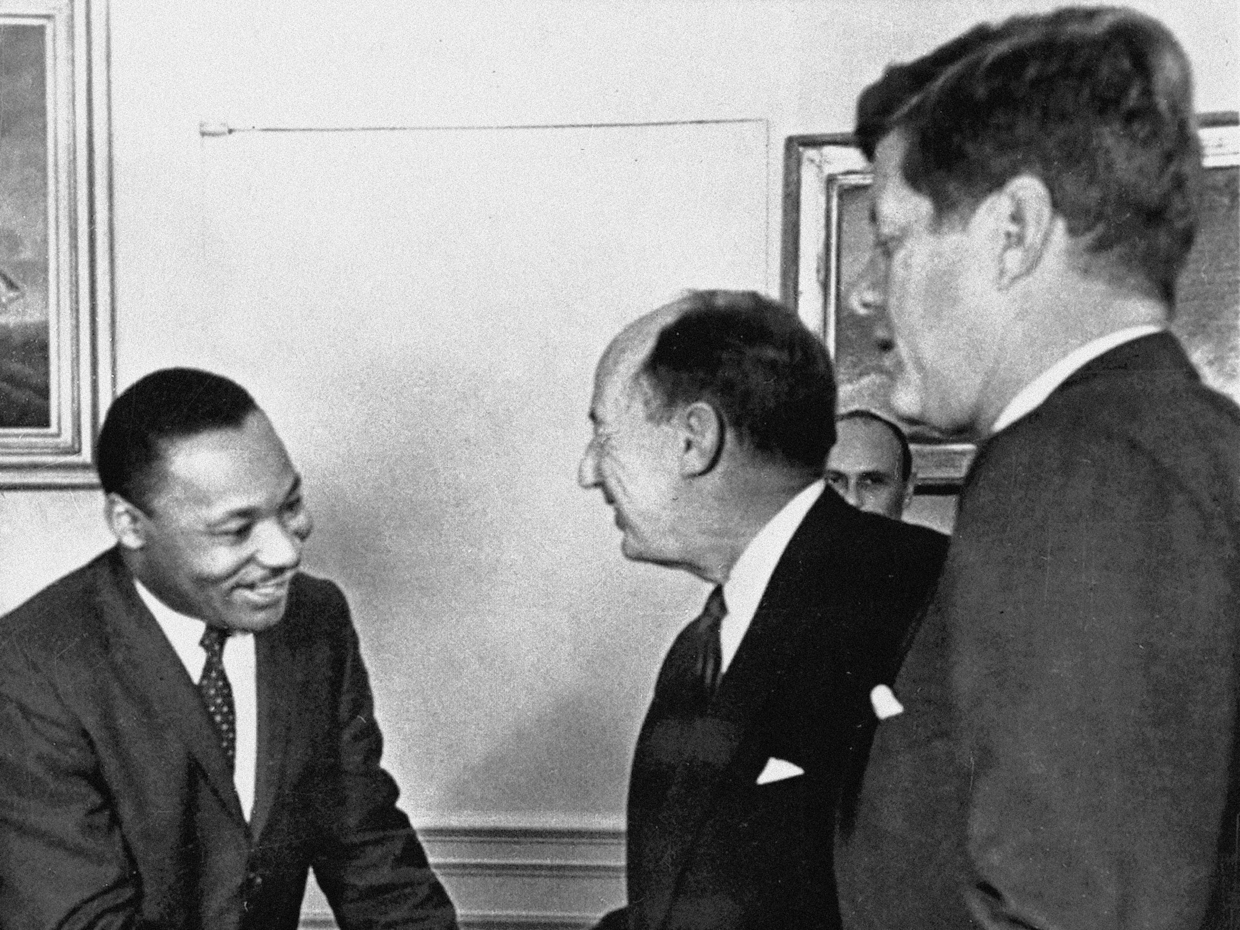 caption: In this Dec. 17, 1962, photo, Ambassador Adlai Stevenson, the U.S. delegate to the United Nations, shakes hands with Martin Luther King Jr., president of the Southern Christian Leadership Conference at the White House with President John F. Kennedy at right. The meeting occurred as Kennedy met with members of the American Negro Leadership Conference on Africa.