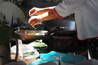 caption: Worldwide, women cook nearly 9 meals a week on average, while men cook only 4, according to a new survey.