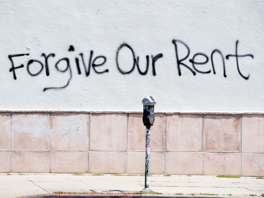 caption: Graffiti on a wall on La Brea Ave. in Los Angeles, Calif. asking for rent forgiveness in May. This week, the city of Los Angeles rolled out a renters relief program to provide more than $100 million in assistance.