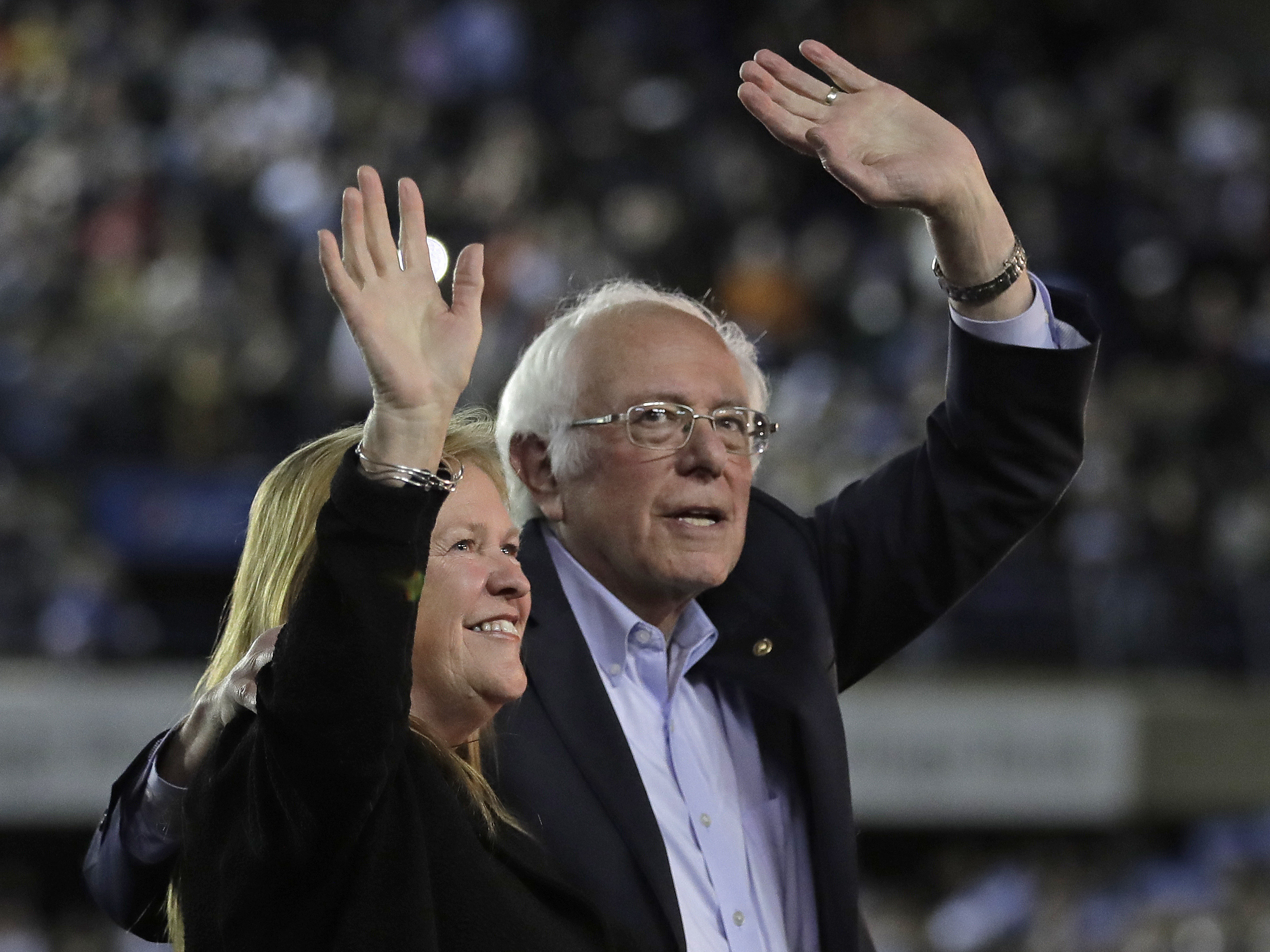 caption: Democratic presidential candidate Sen. Bernie Sanders, I-Vt., waves with his wife, Jane, after his speech at a campaign event in Tacoma, Wash., on Feb. 17.