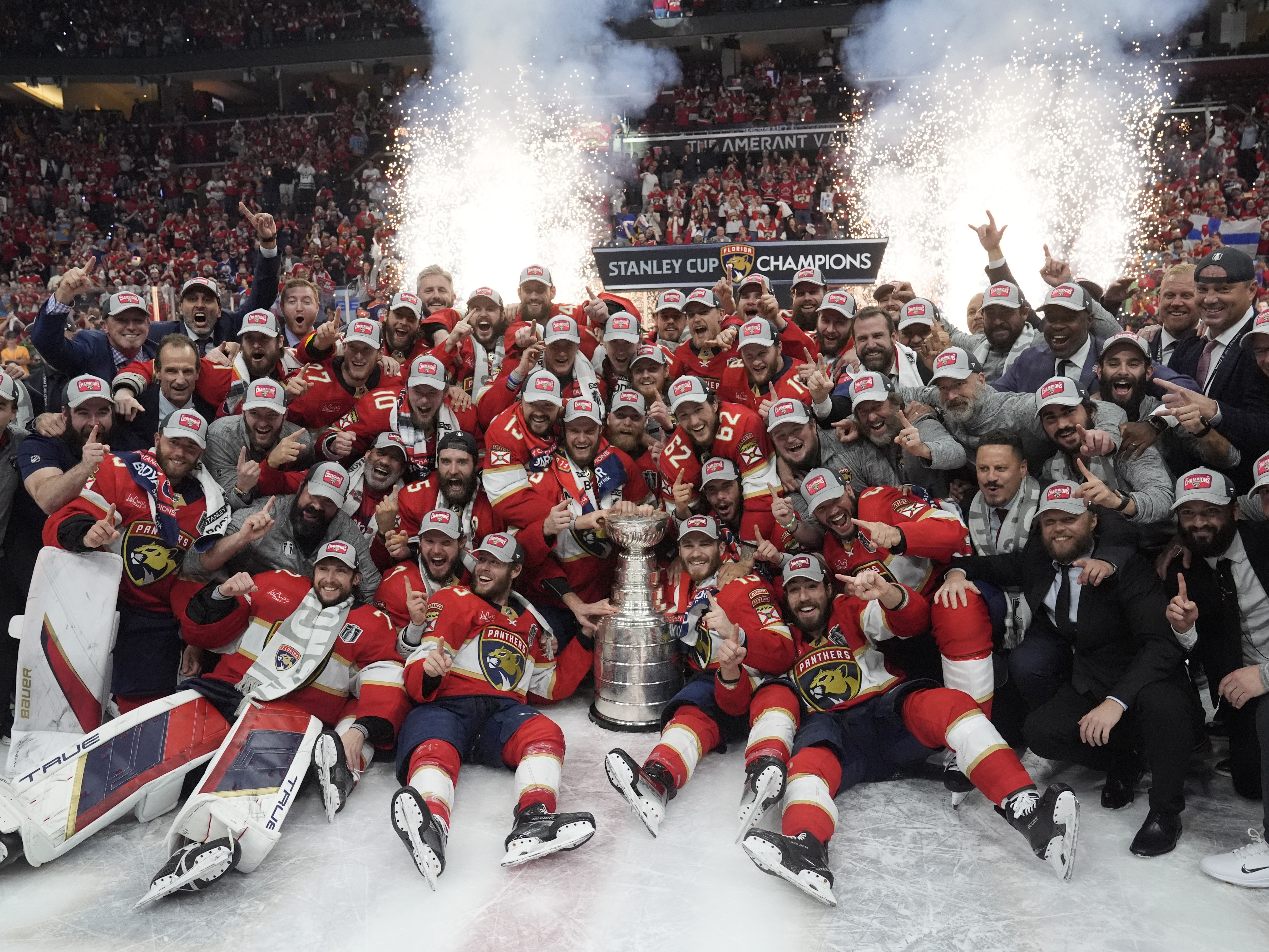 caption: The Florida Panthers team poses with the Stanley Cup trophy after defeating the Edmonton Oilers in Game 7 of the NHL hockey Stanley Cup Final, on Monday in Sunrise, Fla. The Panthers defeated the Oilers 2-1. 