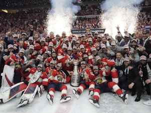 caption: The Florida Panthers team poses with the Stanley Cup trophy after defeating the Edmonton Oilers in Game 7 of the NHL hockey Stanley Cup Final, on Monday in Sunrise, Fla. The Panthers defeated the Oilers 2-1. 