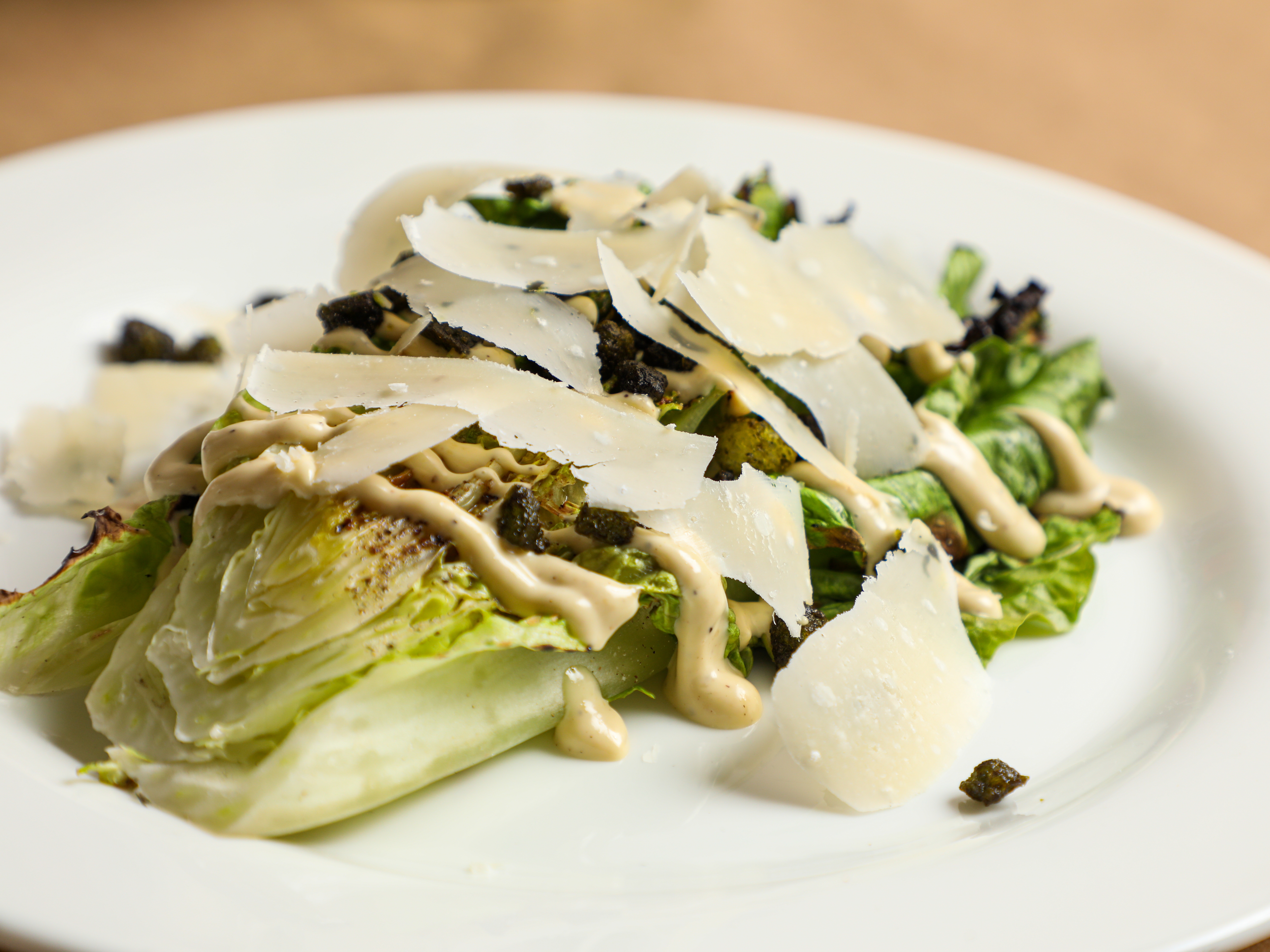 caption: The Caesar salad was born 100 years ago, on July 4, 1924, in Tijuana, Mexico. Above, the grilled romaine Caesar salad at<strong> </strong>Boucherie, a restaurant in uptown New Orleans. 
