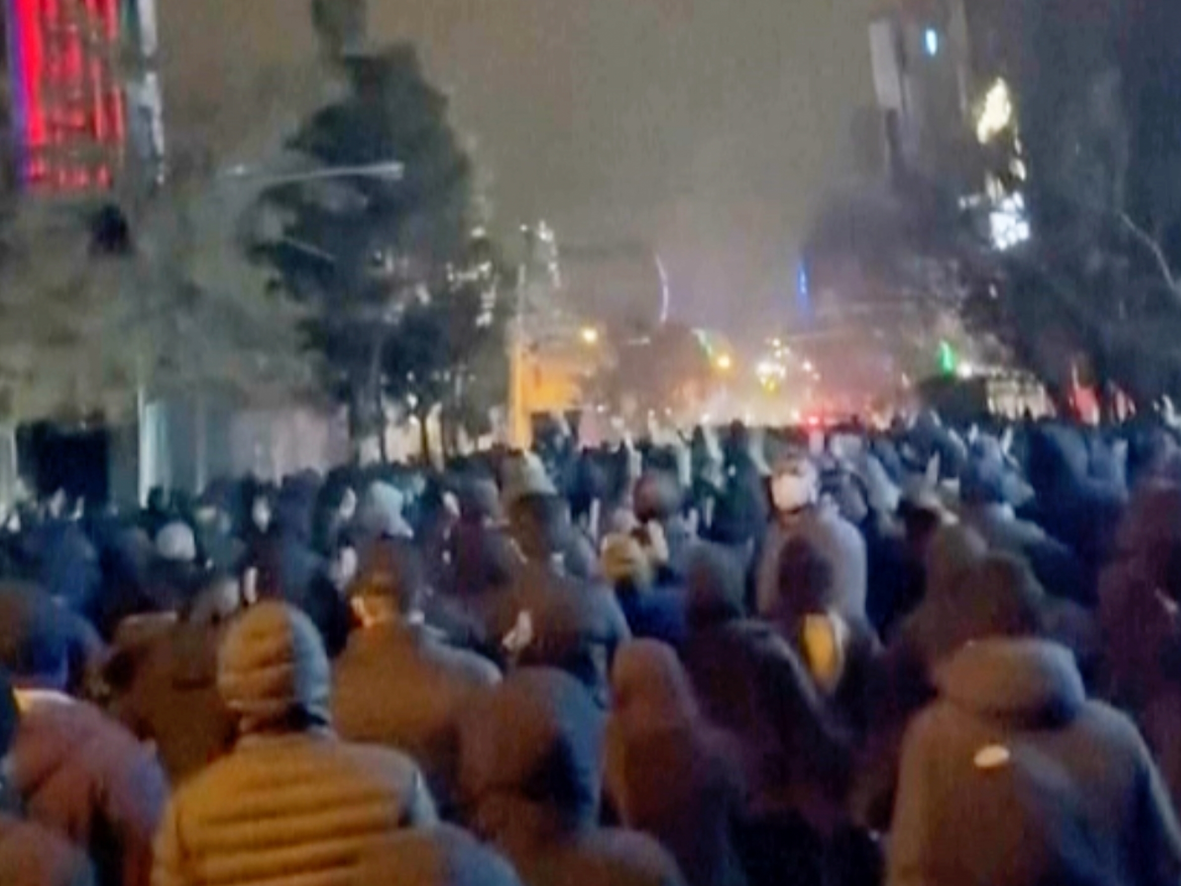 caption: This frame grab from footage circulating on social media from Iran showed protesters once again taking to the streets of Tehran despite an intensifying crackdown as the Islamic Republic remains cut off from the rest of the world in Tehran, Iran, Saturday Jan. 10, 2026.